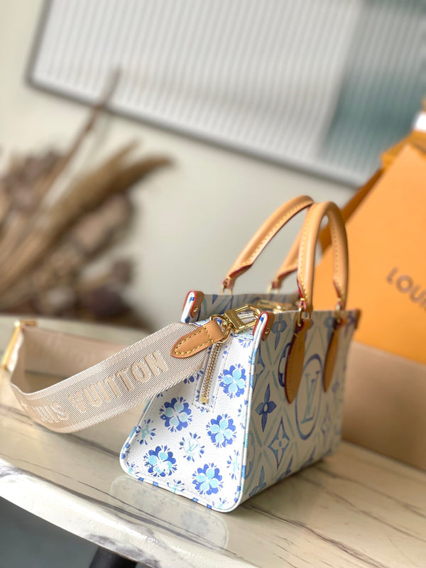 ONTHEGO EAST WEST 25 IN LAGOON BLUE MONOGRAM TILES CANVAS