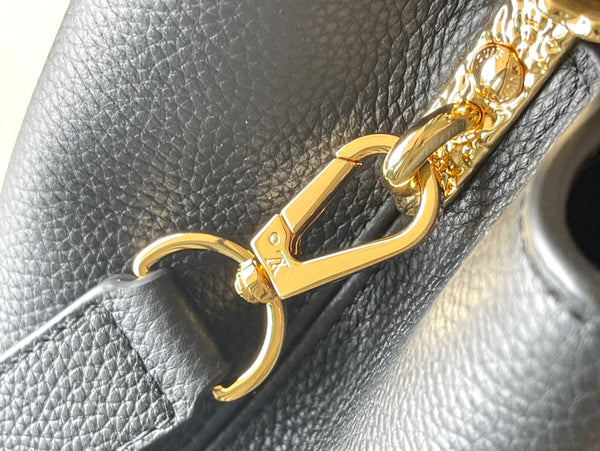 CAPUCINES EAST-WEST 33 IN BLACK CALFSKIN GOLD HARDWARE