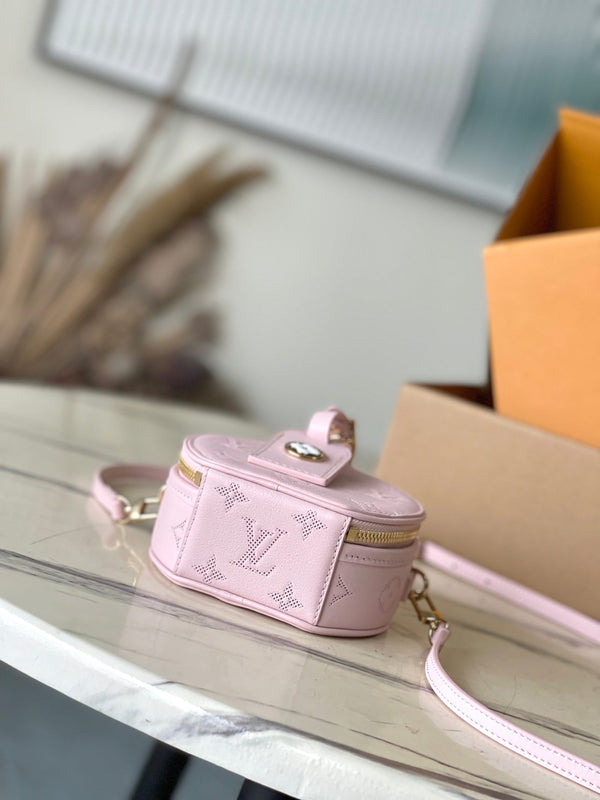 MINI BOITE CHAPEAU 13 IN PELLE DI VITELLO TRAFORATA CON MONOGRAMMA ROSA CHIARO