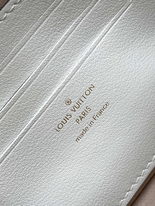 PORTAFOGLIO CON CATENA IVY 23 IN PELLE DI VITELLO TRAFORATA CON MONOGRAMMA BIANCO E FERRAMENTA ORO