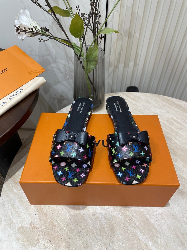 BOW FLAT MULES IN BLACK MONOGRAM LAMBSKIN