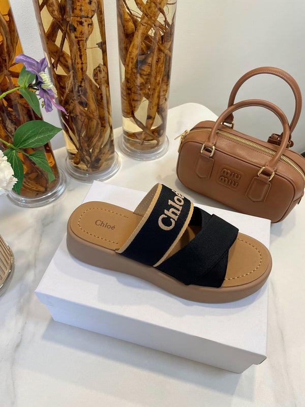 CHLOÉ WOODY WEDGE SANDALS IN BLACK CANVAS WITH CIDER BROWN RUBBER SOLE