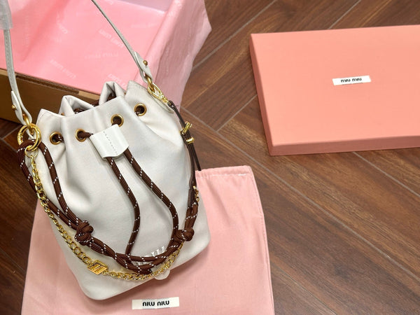 DRAWSTRING BUCKET BAG 21 IN WHITE CANVAS GOLD HARDWARE