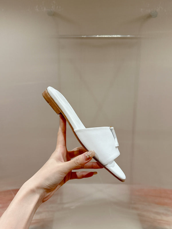 lv capri flat mule white calfskin