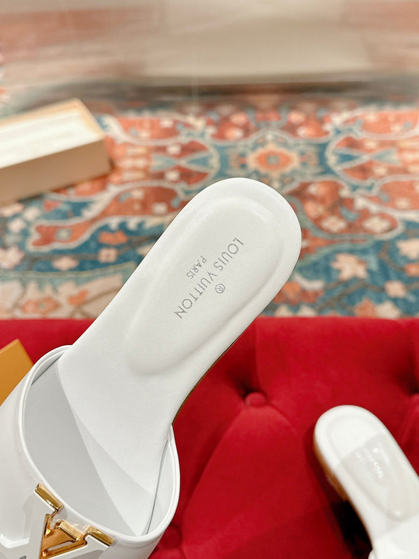 lv capri flat mule white calfskin