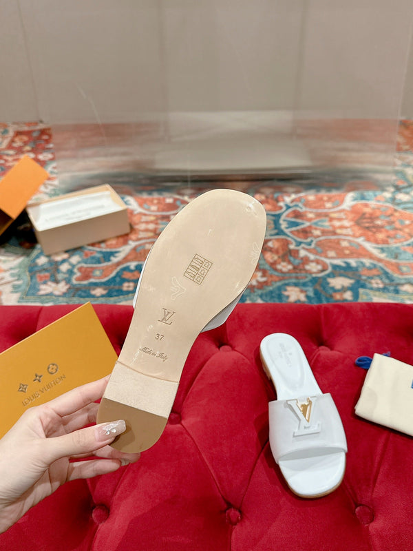 lv capri flat mule white calfskin