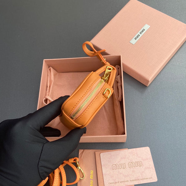 MICRO BAG KEYCHAIN 11 IN HOT CINNAMON ORANGE CALFSKIN EMBOSSED LOGO