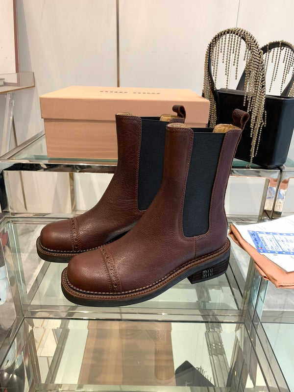 Stivali Miu in pelle di vacchetta mista vegetale color marrone terra