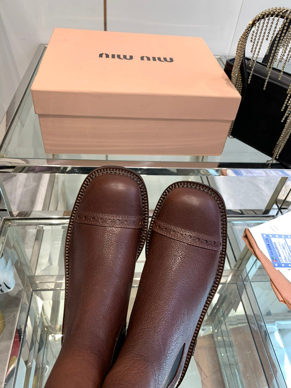 Stivali Miu in pelle di vacchetta mista vegetale color marrone terra