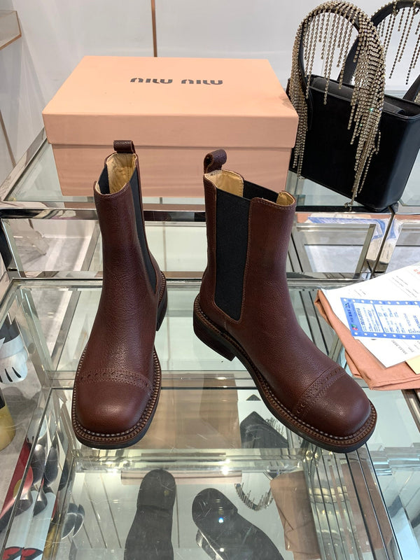 Stivali Miu in pelle di vacchetta mista vegetale color marrone terra