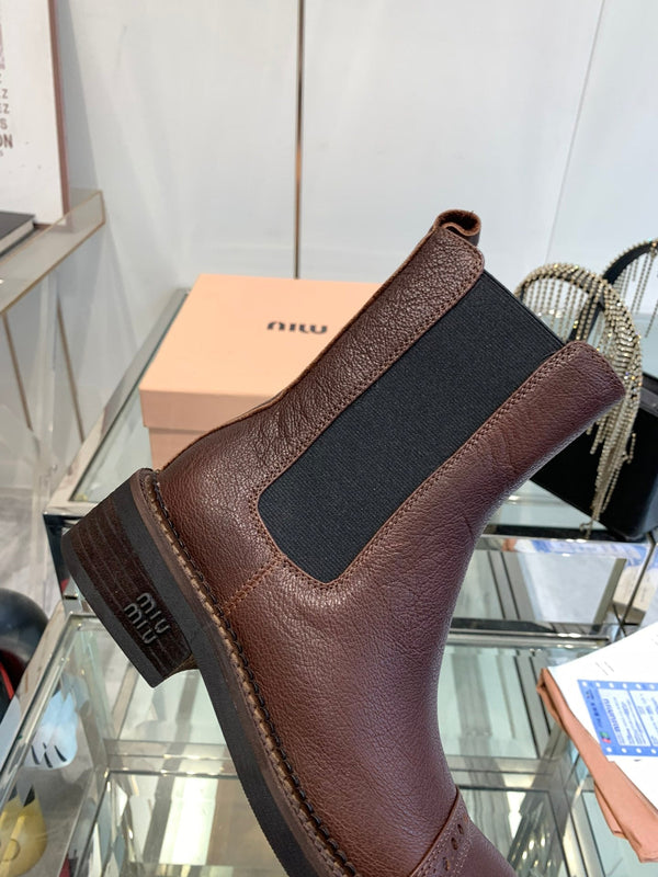 Stivali Miu in pelle di vacchetta mista vegetale color marrone terra