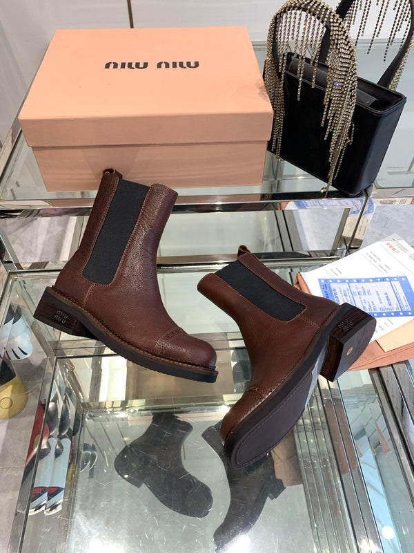 Stivali Miu in pelle di vacchetta mista vegetale color marrone terra