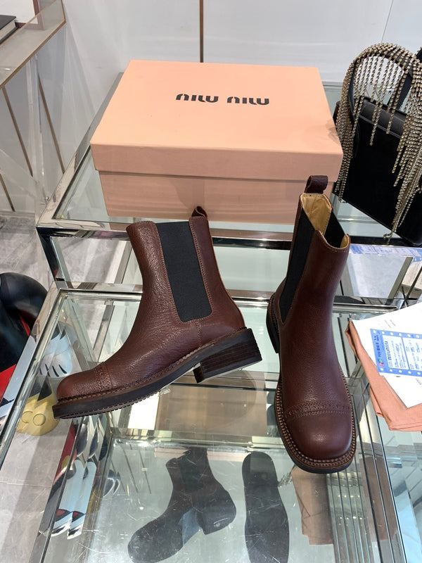 Stivali Miu in pelle di vacchetta mista vegetale color marrone terra