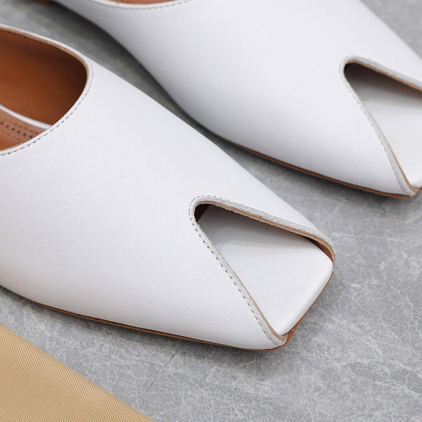 ALAIA FLAT MULE IN WHITE LAMBSKIN
