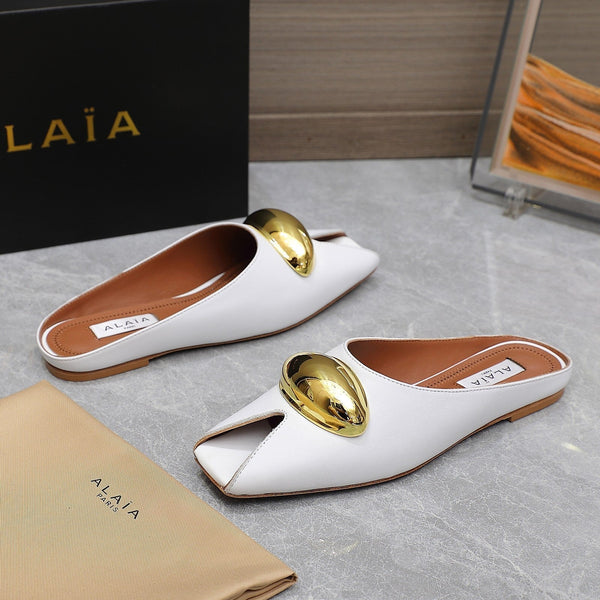 ALAIA FLAT MULE IN WHITE LAMBSKIN WITH GOLD HARDWARE