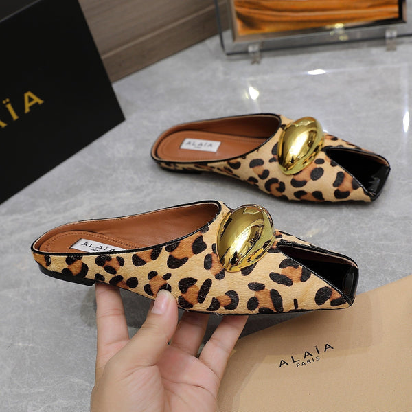 ALAIA FLAT MULE IN LEOPARD LAMBSKIN WITH GOLD HARDWARE