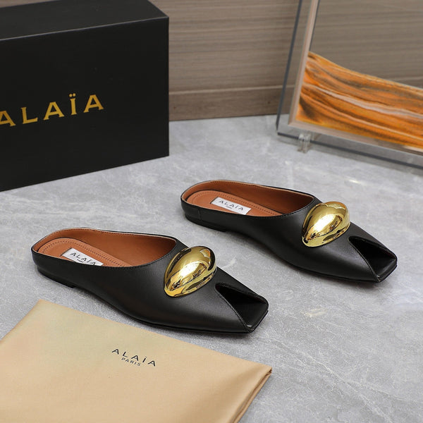 ALAIA FLAT MULE IN BLACK LAMBSKIN WITH GOLD HARDWARE