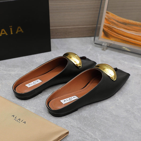 ALAIA FLAT MULE IN BLACK LAMBSKIN WITH GOLD HARDWARE
