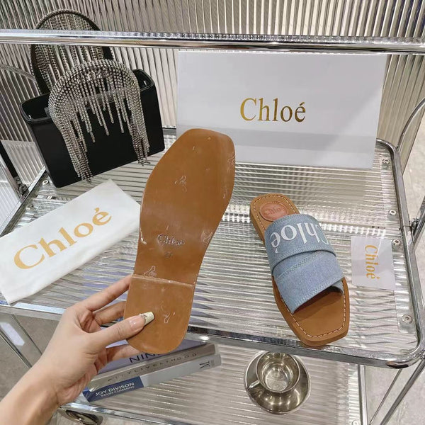 CHLOÉ WOODY MULE IN LIGHT BLUE DENIM WITH WHITE LOGO