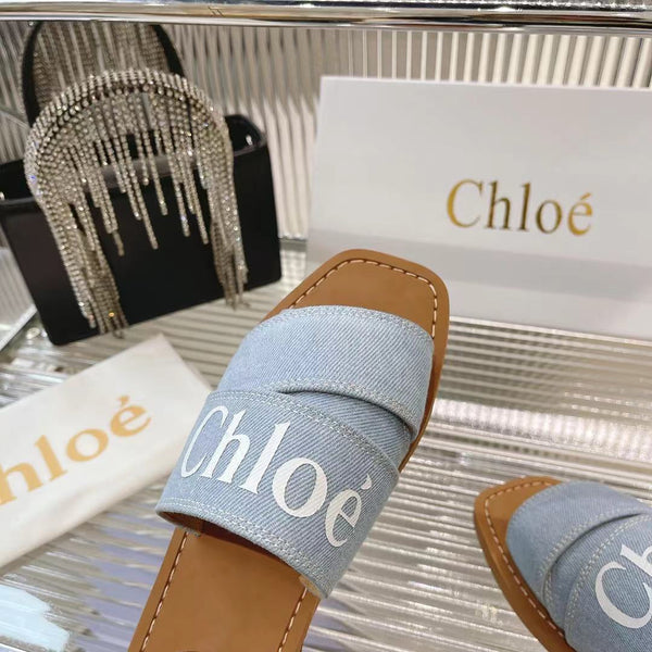 CHLOÉ WOODY MULE IN LIGHT BLUE DENIM WITH WHITE LOGO
