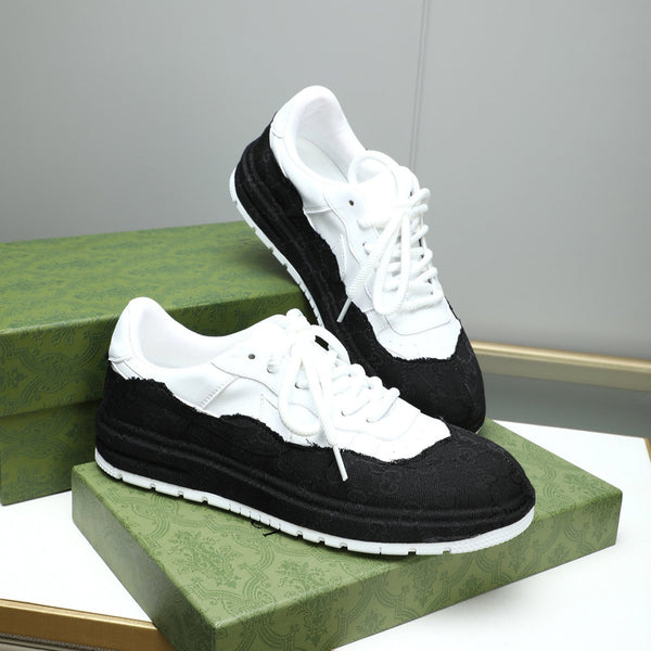 Sneaker da uomo GG in pelle di vacchetta nera e bianca 587317