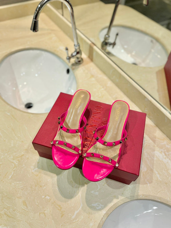 SANDALI ROCKSTUD MULE IN VITELLO ROSA BRILLANTE E FILM IN PVC TRASPARENTE