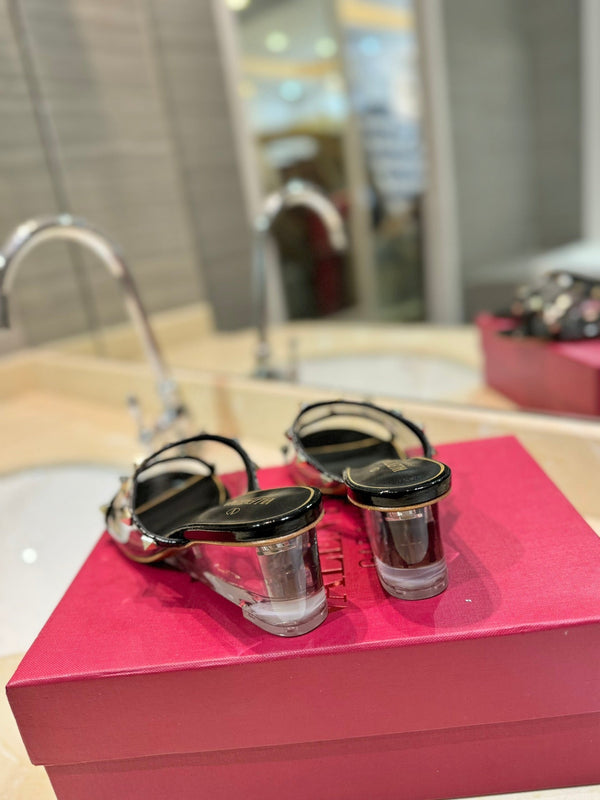 SANDALI ROCKSTUD MULE IN VITELLO NERO E FILM IN PVC TRASPARENTE