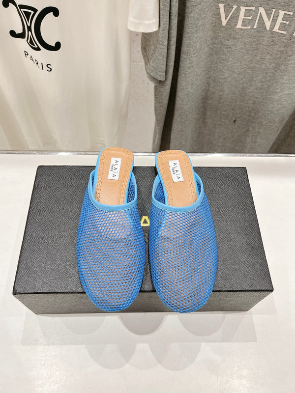 ALAIA FLAT MULES IN CERULEAN BLUE MESH FISHNET