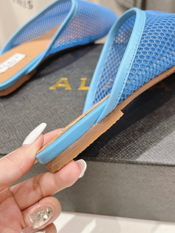 ALAIA FLAT MULES IN CERULEAN BLUE MESH FISHNET