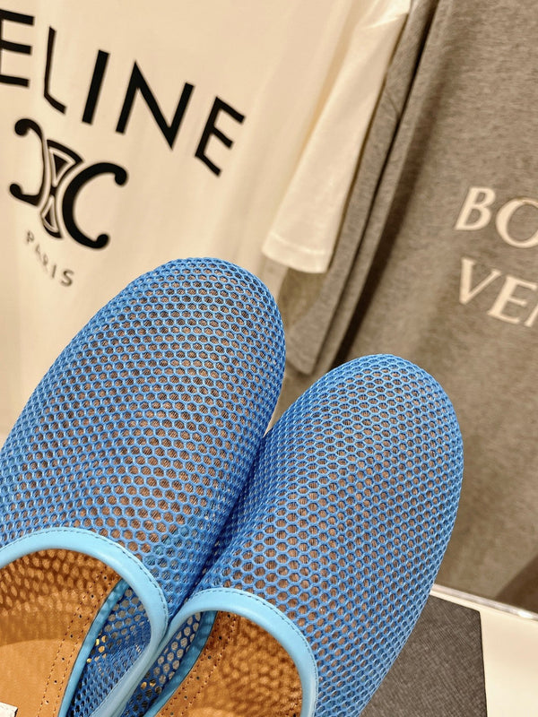 ALAIA FLAT MULES IN CERULEAN BLUE MESH FISHNET