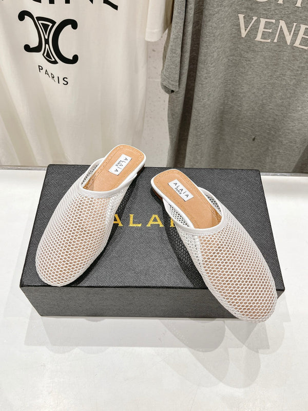 MULES ALAIA FLAT IN RETE BIANCA