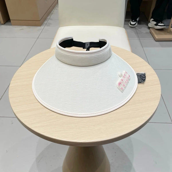 CAPPELLINO CON VISIERA MM FASHION IN BIANCO E NERO CON RICAMO DEL LOGO E DEL TESTO