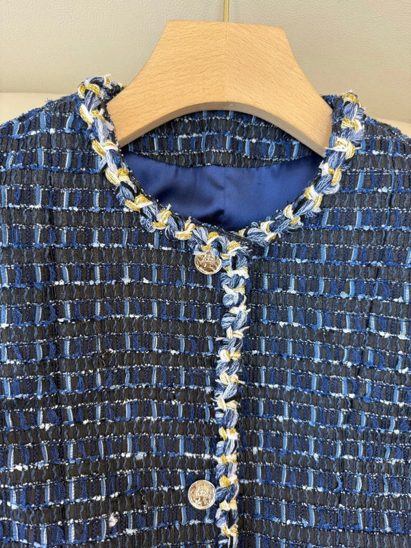 CHANEL Gilet sans manches en tweed 25S 491