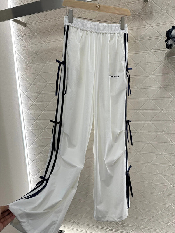 MIUMIU HIGH-WAISTED WIDE-LEG PANTS WITH BOW 276654