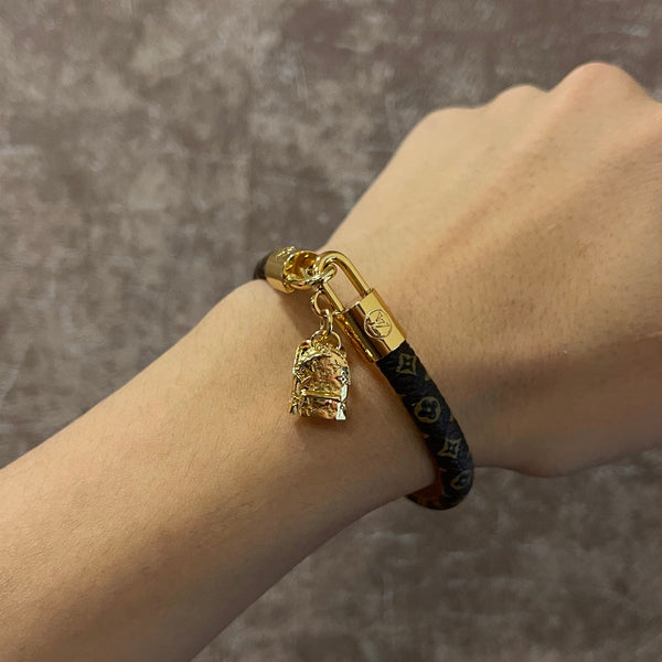 ZAINO LV CON CINTURINO IN PELLE E BRACCIALE IN ORO