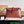 Borsa a tracolla BV Liberta con fibbia, 30 cm, in pelle di vacchetta rosso mattone