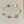 STAR AND SUN 5 MOTIF MOP PINK GOLD BRACELET