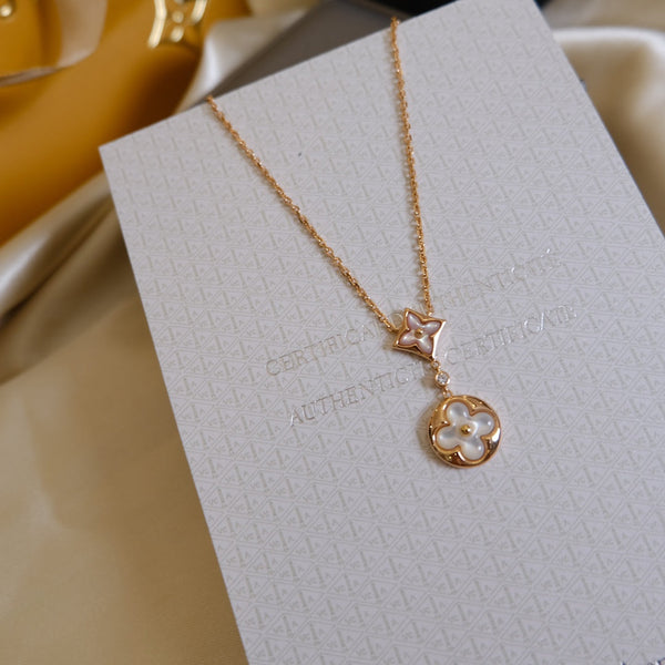 COLLANA IN ORO ROSA CON MOTIVO STELLA E SOLE BIANCO MOP 2 