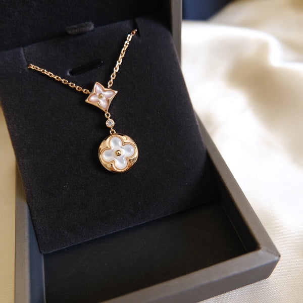 COLLANA IN ORO ROSA CON MOTIVO STELLA E SOLE BIANCO MOP 2 