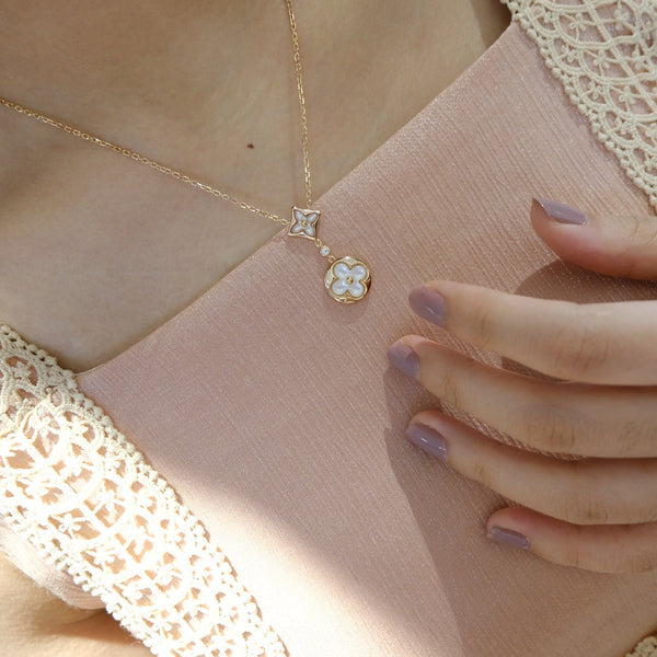 COLLANA IN ORO ROSA CON MOTIVO STELLA E SOLE BIANCO MOP 2 
