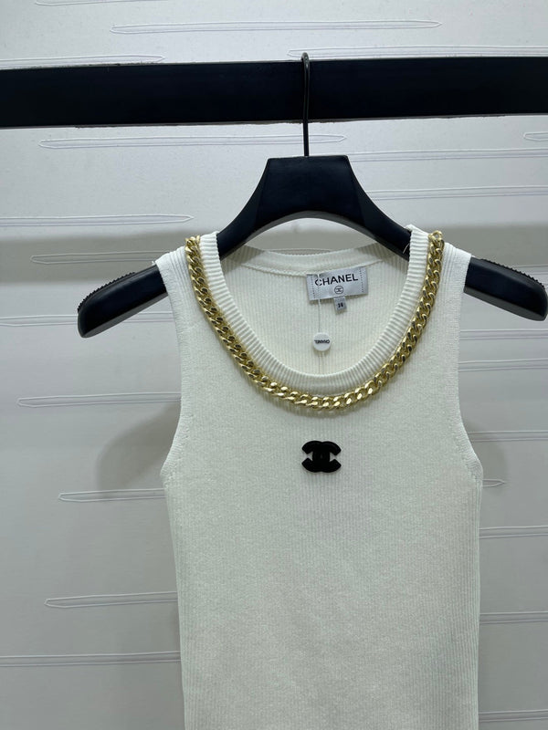 GILET EN MAILLE TRICOTÉE AVEC CHAÎNE CHANEL 26 EN LAINE NOIRE 335389