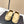 Ballerines Chanel en agneau beiges et noires avec logo CC entrelacé 591390