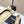 Ballerines Chanel en agneau beiges et noires avec logo CC entrelacé 591390