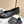 Ballerine Chanel siglée CC entrelacés en agneau noir 591388