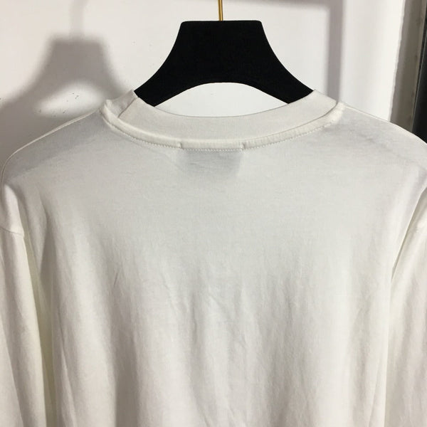 T-shirt à manches longues et col rond Chanel avec blocs de couleurs et rayures, et poche