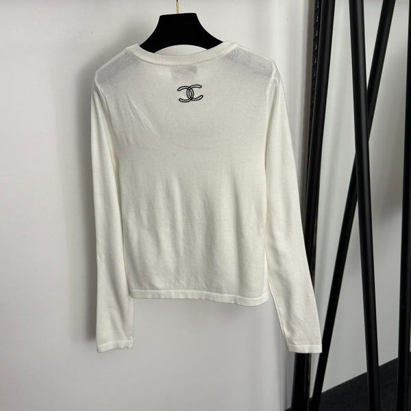 T-shirt en maille à manches longues Chanel avec logo Chanel brodé