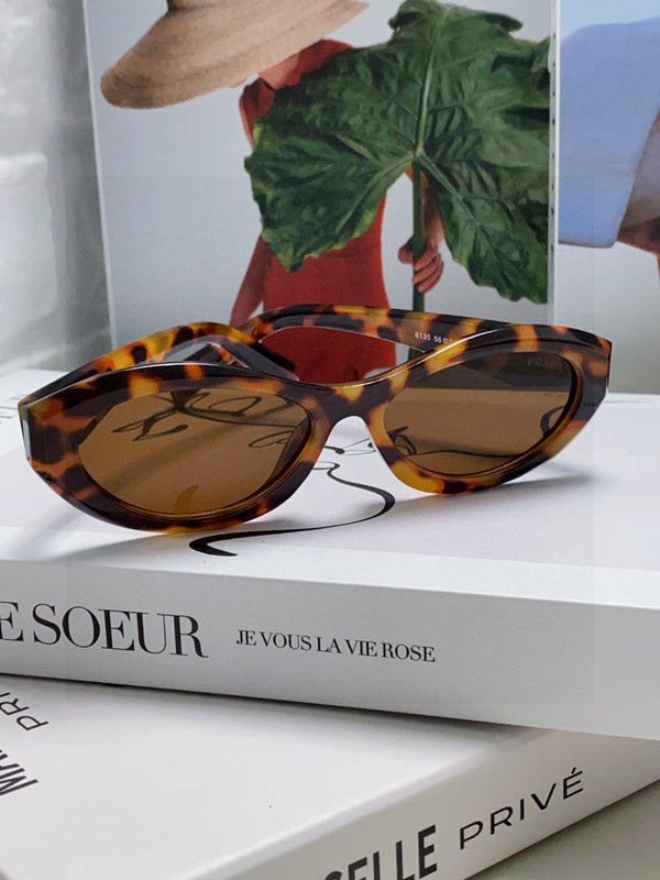 Lunettes de soleil Prada 18