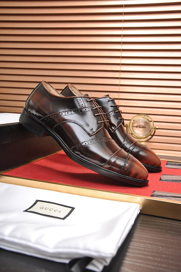 Scarpa elegante da uomo GG in pelle di vacchetta marrone 499520