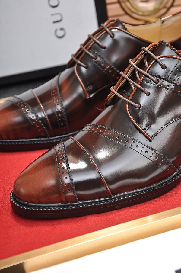 Scarpa elegante da uomo GG in pelle di vacchetta marrone 499520