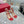 SANDALO INFRADITO ROCKSTUD CON CINTURINI IN PELLE DI VITELLO ROSSO CILIEGIA